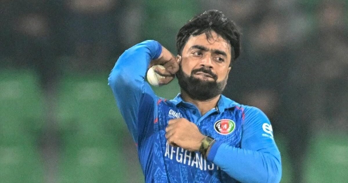 Afghanistan captain Rashid Khan bowling in Afghanistan blue