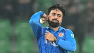 Afghanistan captain Rashid Khan bowling in Afghanistan blue