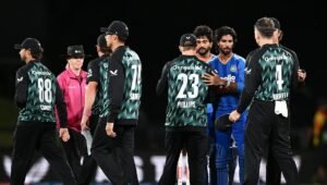 New Zealand players, including Glenn Phillips and Devon Conway, greet Tilak Varma after the second T20I between New Zealand and India in Christchurch