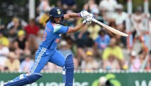 Harmanpreet Kaur playing a shot for India Women in the blue ODI kit