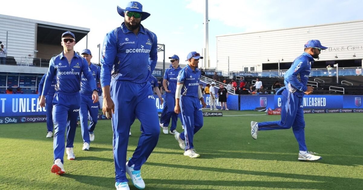 Kieron Pollard walking out with his Mumbai Indians team-mates